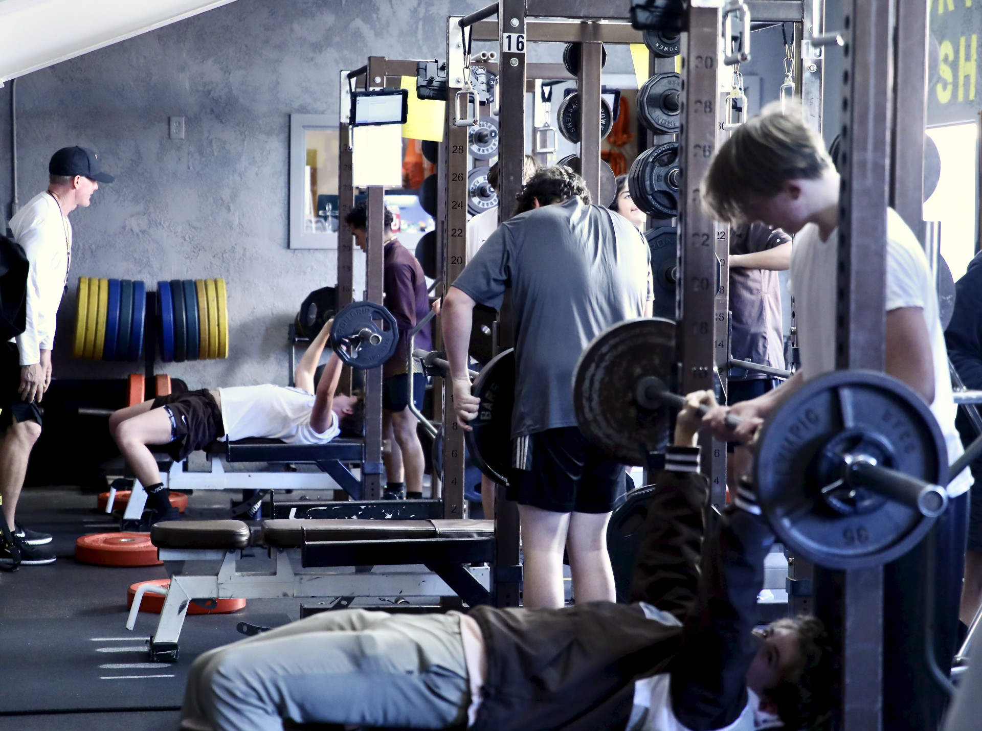 Coach Garner instructing lifting students