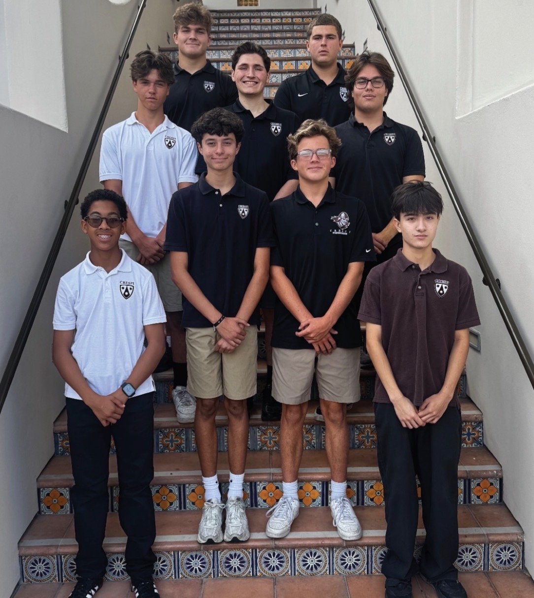 Crespi students standing on the tiled stairs of the Fine Arts Building